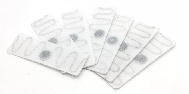Etiqueta RFID para rastreamento de lavanderia têxtil UHF para hotel e hospital resistente ao calor