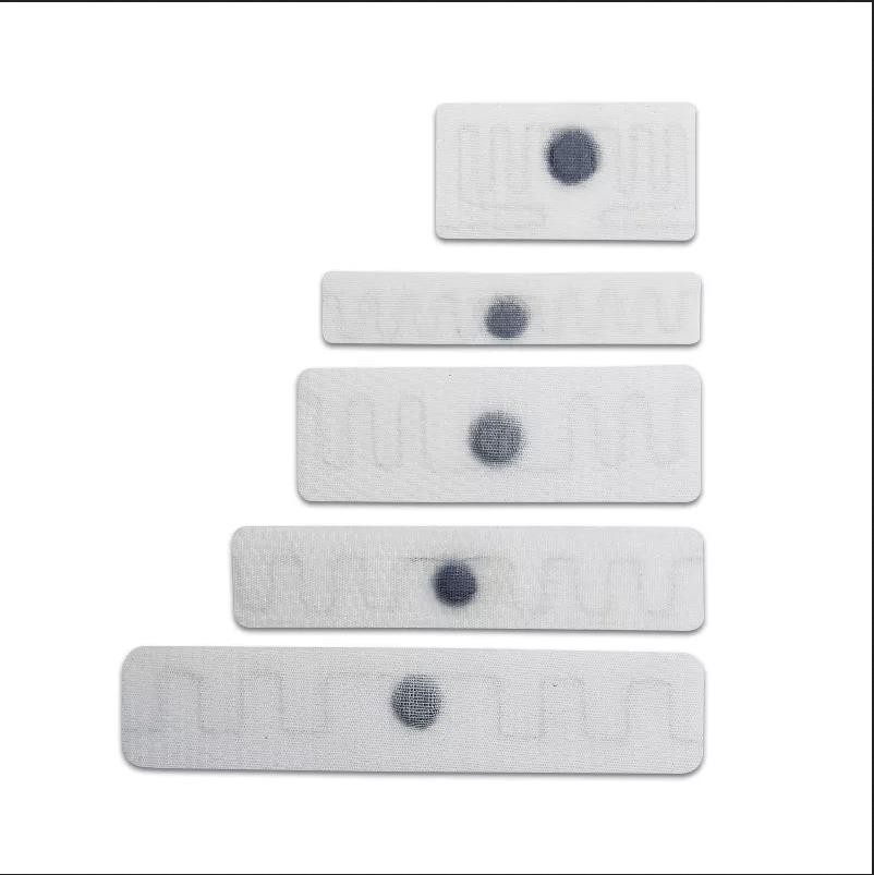 Etiqueta RFID para rastreamento de lavanderia têxtil UHF para hotel e hospital resistente ao calor