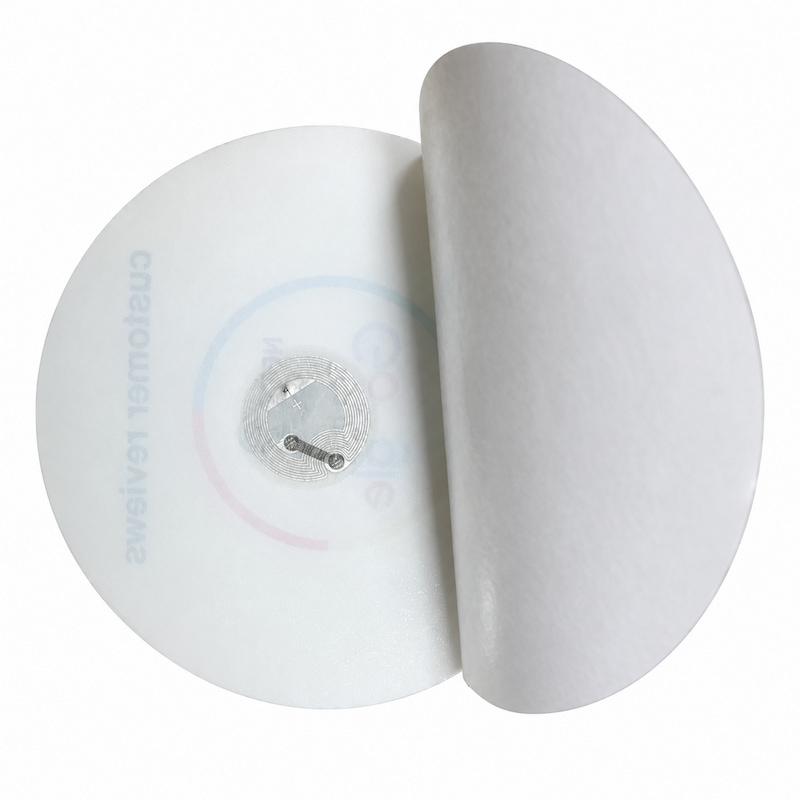 Round acrylic NFC review plaque with peeled adhesive backing showing the embedded NFC antenna